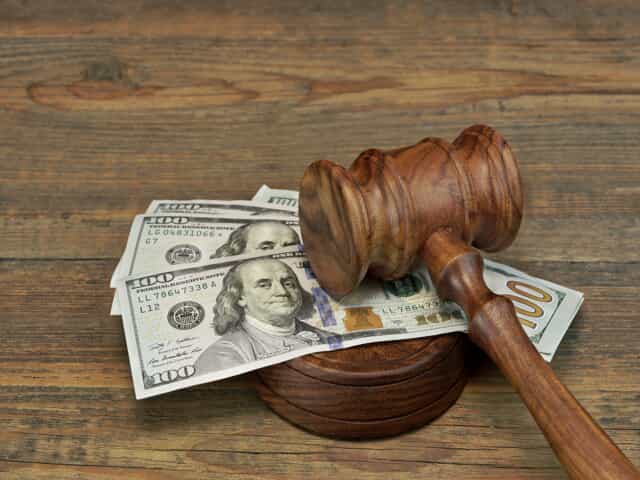 Gavel and money representing alimony laws in Colorado 